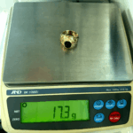 17.3 gram gold ring on scale