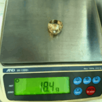 18.4 gram gold ring on scale
