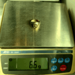 6.6 gram gold ring on scale