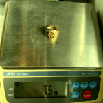 7.5 gram gold ring on scale