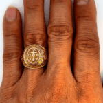 us navy gold ring on hand